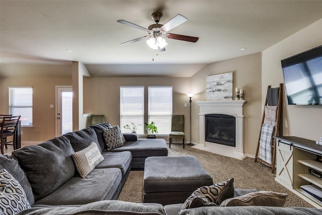 2613 Hillrich Dr, Anna, TX 75409 - living room with carpet floors, a ceiling fan, a glass covered fireplace, and baseboards