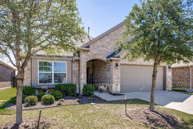 2613 Hillrich Dr, Anna, TX 75409 - view of front of property with driveway, an attached garage, brick siding, and a front yard