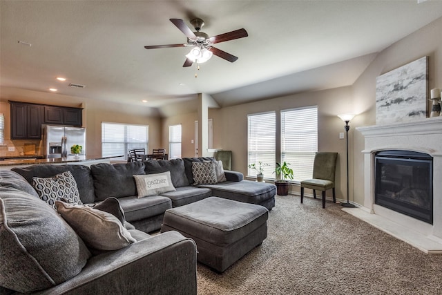2613 Hillrich Dr, Anna, TX 75409 - living area featuring light carpet, a ceiling fan, recessed lighting, a glass covered fireplace, and baseboards