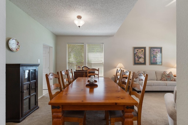 3942 Luke Ln, Carrollton, TX 75007 - dining space with light colored carpet and a textured ceiling