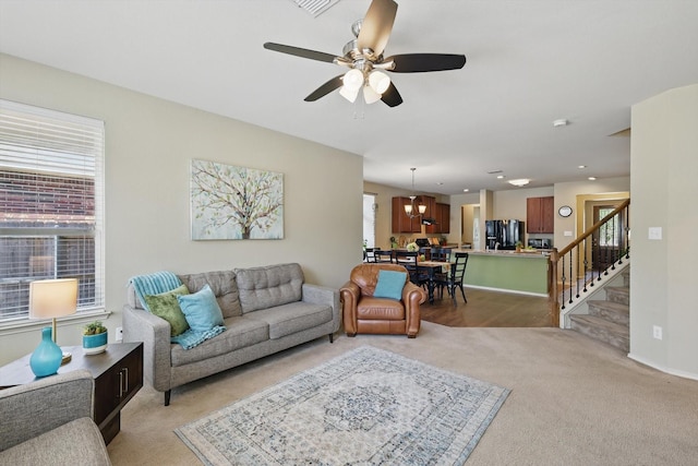 5321 Threshing Dr, Fort Worth, TX 76179 - living area with light carpet, plenty of natural light, a ceiling fan, and stairs