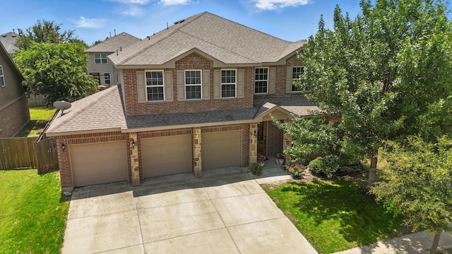 5321 Threshing Dr, Fort Worth, TX 76179 - traditional-style home with brick siding, a shingled roof, concrete driveway, and an attached garage