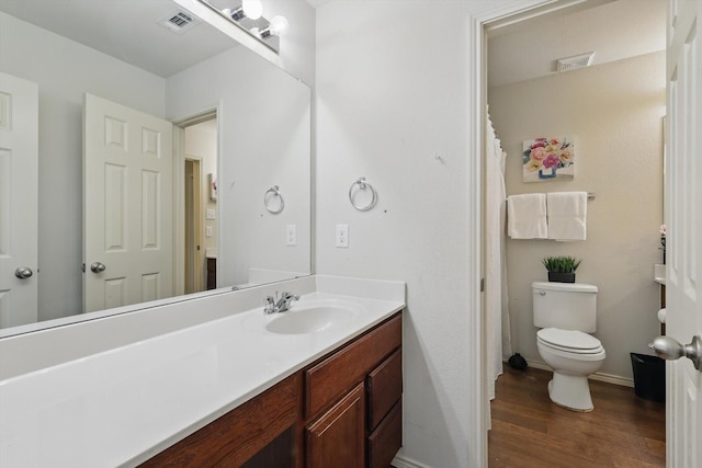 5321 Threshing Dr, Fort Worth, TX 76179 - bathroom featuring toilet, wood finished floors, vanity, baseboards, and curtained shower