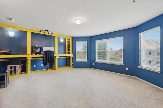 5321 Threshing Dr, Fort Worth, TX 76179 - unfurnished living room featuring an office area, carpet, healthy amount of natural light, and baseboards