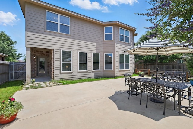 5321 Threshing Dr, Fort Worth, TX 76179 - rear view of house with a patio area, outdoor dining space, and brick siding