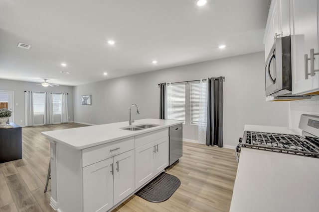 2105 Rolling Wild Rd, Forney, TX 75126 - kitchen featuring a sink, stainless steel appliances, recessed lighting, white cabinets, and baseboards