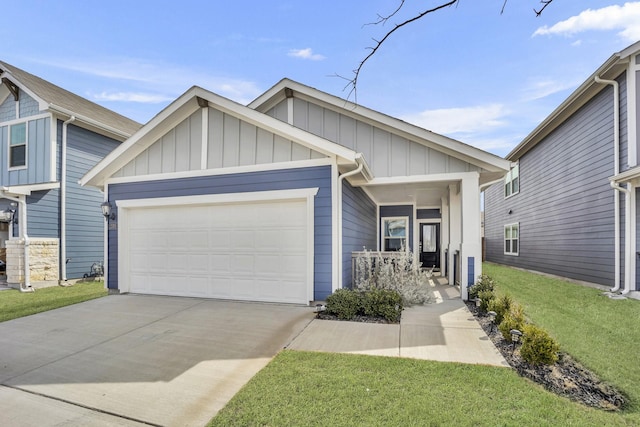 2105 Rolling Wild Rd, Forney, TX 75126 - view of front of property featuring board and batten siding, an attached garage, driveway, a front yard, and covered porch