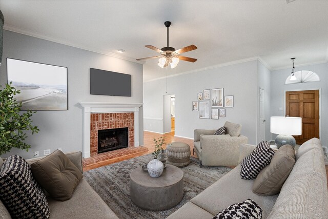 6319 Woolwich Dr, Arlington, TX 76001 - living room featuring crown molding, ceiling fan, and a brick fireplace