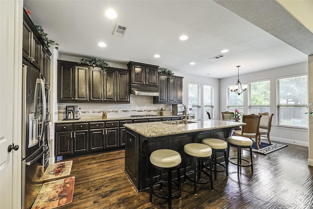 955 Champions Way, Roanoke, TX 76262 - kitchen with under cabinet range hood, dark wood-style flooring, appliances with stainless steel finishes, a sink, and recessed lighting