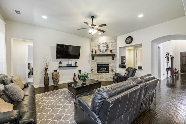 955 Champions Way, Roanoke, TX 76262 - living room featuring ceiling fan, arched walkways, wood finished floors, a stone fireplace, and baseboards
