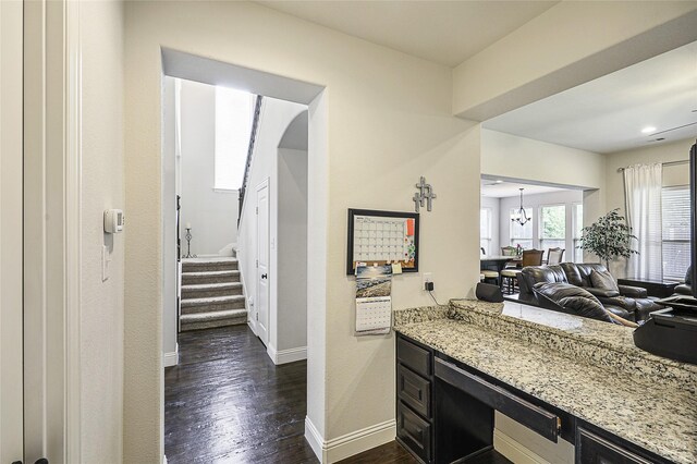 955 Champions Way, Roanoke, TX 76262 - kitchen with dark wood-style flooring, light stone counters, baseboards, and open floor plan