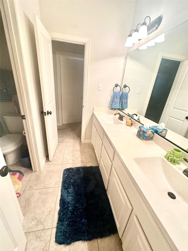 955 Champions Way, Roanoke, TX 76262 - full bathroom featuring double vanity, tile patterned floors, and toilet