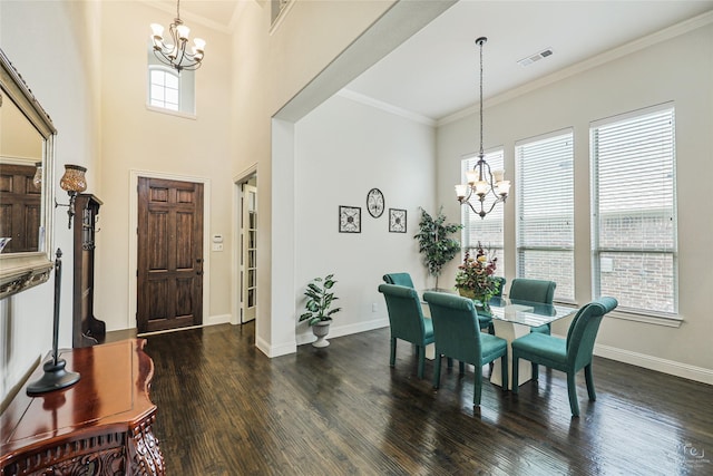955 Champions Way, Roanoke, TX 76262 - dining room with a chandelier, a high ceiling, dark wood-type flooring, baseboards, and crown molding