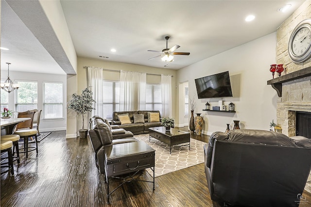 955 Champions Way, Roanoke, TX 76262 - living room featuring dark wood-style floors, ceiling fan, baseboards, a stone fireplace, and recessed lighting