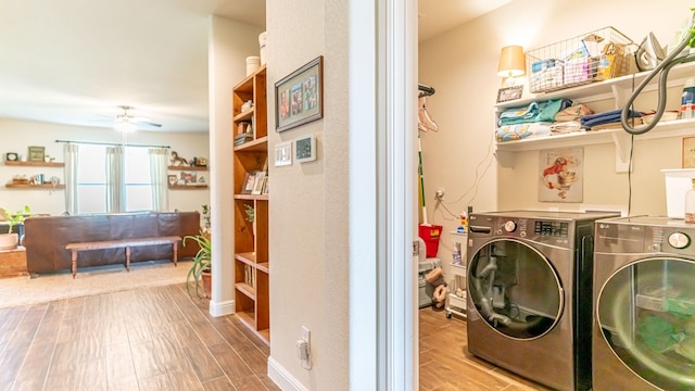 1715 Swale Ln, Granbury, TX 76049 - laundry room featuring washer and dryer, a ceiling fan, and wood finished floors