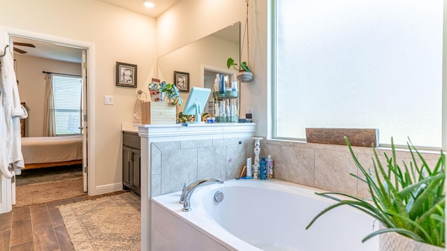 1715 Swale Ln, Granbury, TX 76049 - ensuite bathroom with vanity and a garden tub