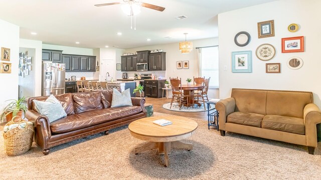 1715 Swale Ln, Granbury, TX 76049 - living area with ceiling fan, light colored carpet, and recessed lighting