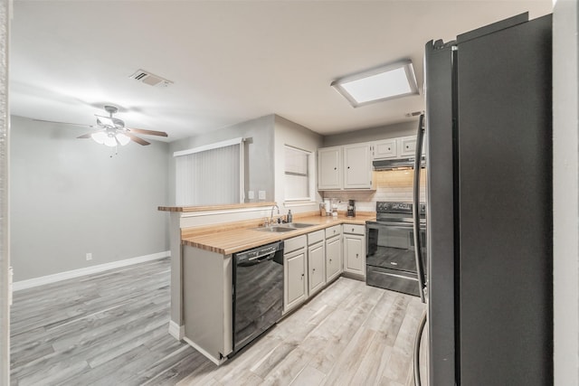 5622 Polo Club Dr, Arlington, TX 76017 - kitchen with black appliances, a sink, light wood-type flooring, baseboards, and a ceiling fan