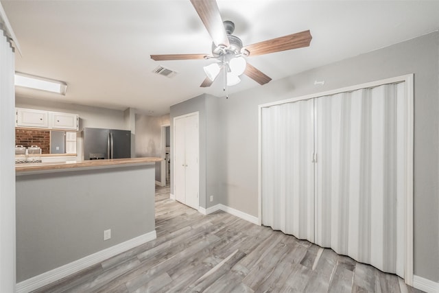 5622 Polo Club Dr, Arlington, TX 76017 - unfurnished living room featuring ceiling fan, baseboards, and light wood-style flooring