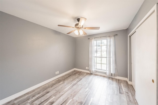 5622 Polo Club Dr, Arlington, TX 76017 - spare room with light wood finished floors, ceiling fan, and baseboards