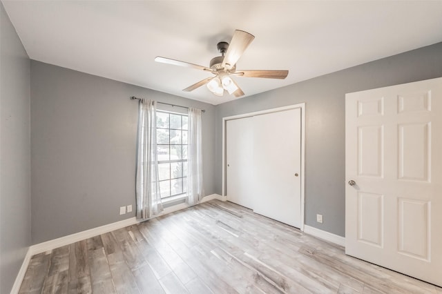 5622 Polo Club Dr, Arlington, TX 76017 - unfurnished bedroom featuring light wood-style floors, a closet, baseboards, and ceiling fan
