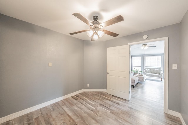 5622 Polo Club Dr, Arlington, TX 76017 - empty room with a ceiling fan, light wood finished floors, and baseboards