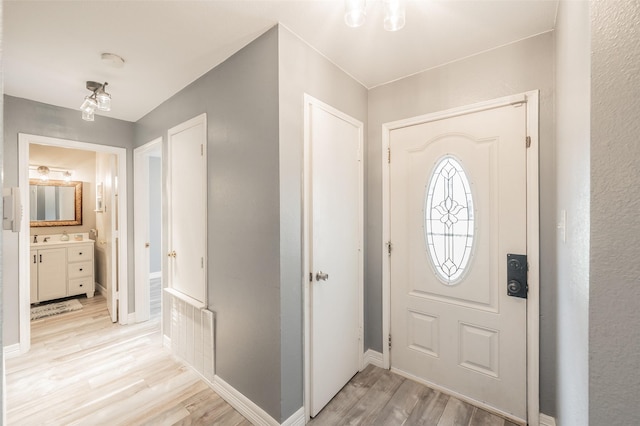 5622 Polo Club Dr, Arlington, TX 76017 - foyer entrance with light wood-type flooring and baseboards
