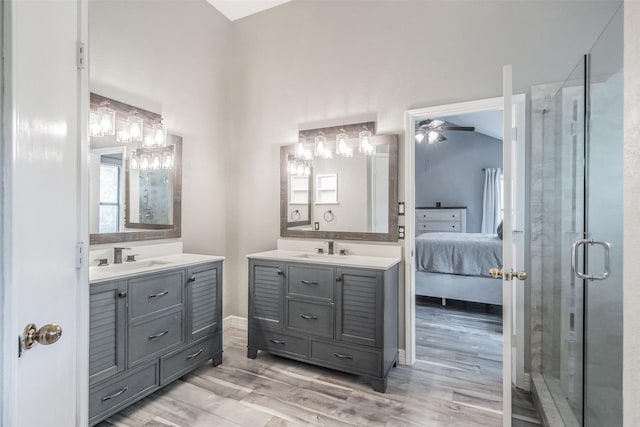 5622 Polo Club Dr, Arlington, TX 76017 - ensuite bathroom with a ceiling fan, two vanities, wood finished floors, and a shower stall