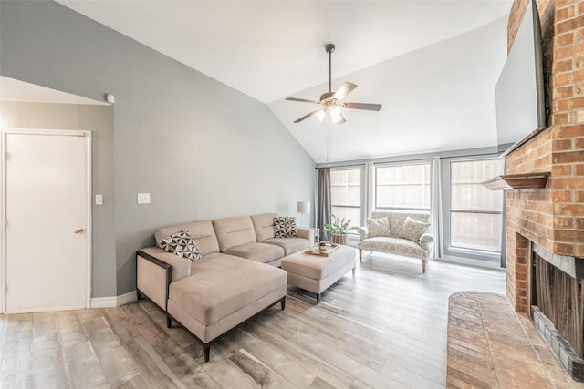 5622 Polo Club Dr, Arlington, TX 76017 - living room with a fireplace, ceiling fan, vaulted ceiling, light wood-style flooring, and baseboards