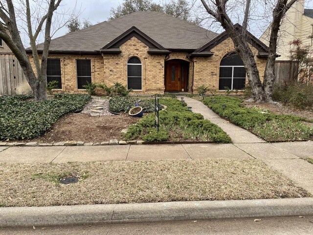 404 L Thompson St, Cedar Hill, TX 75104 - view of front of house featuring brick siding and roof with shingles