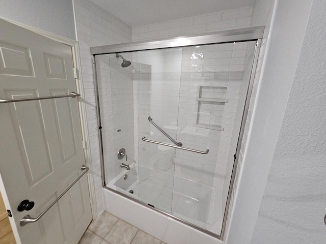 404 L Thompson St, Cedar Hill, TX 75104 - full bath with combined bath / shower with glass door, tile patterned flooring, and a textured wall