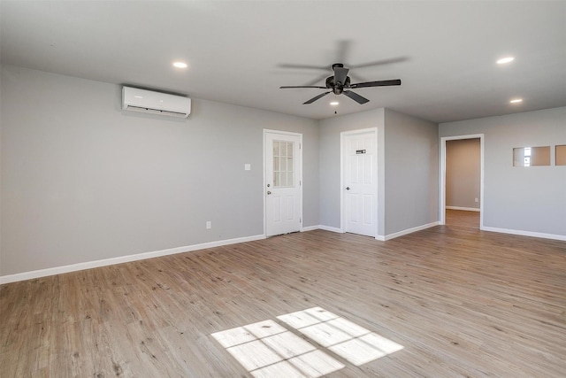 3614 County Road 902, Joshua, TX 76058 - unfurnished living room with a wall mounted AC, a ceiling fan, light wood-style flooring, baseboards, and recessed lighting