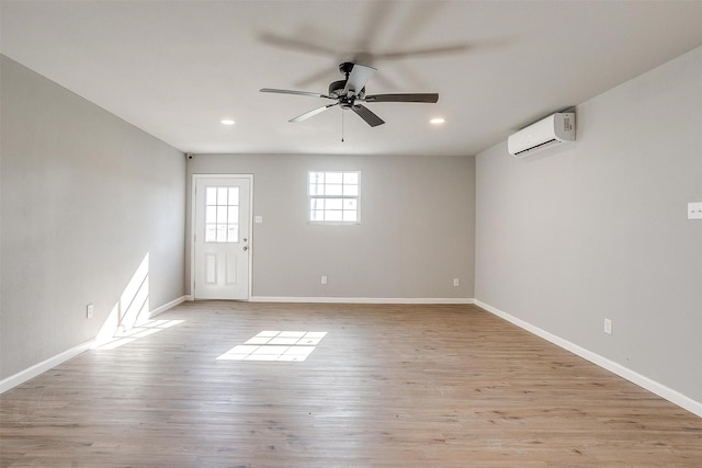 3614 County Road 902, Joshua, TX 76058 - unfurnished room featuring a wall unit AC, a ceiling fan, recessed lighting, baseboards, and light wood-style flooring