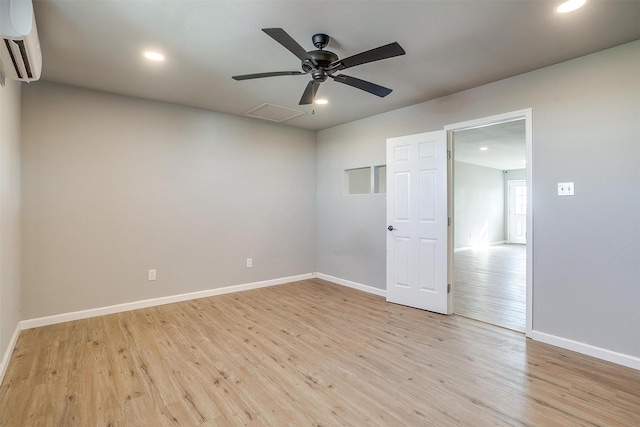 3614 County Road 902, Joshua, TX 76058 - unfurnished room featuring an AC wall unit, light wood-style flooring, recessed lighting, and baseboards