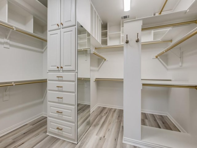4414 Westway Ave, Highland Park, TX 75205 - walk in closet featuring light wood-type flooring
