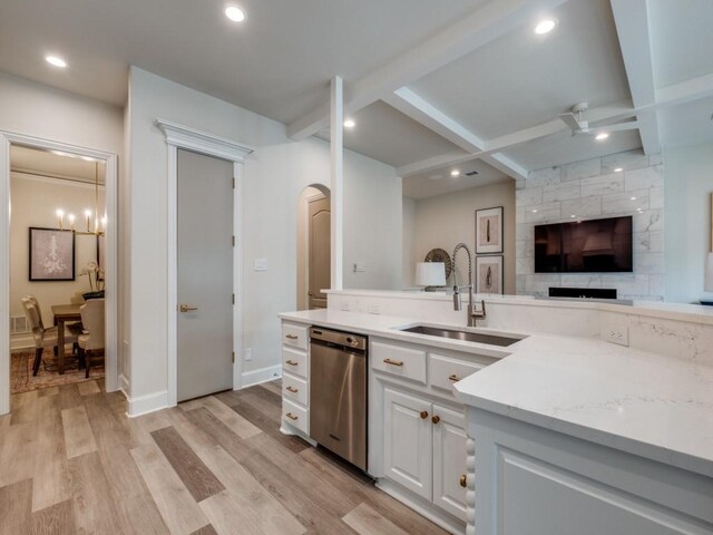 4414 Westway Ave, Highland Park, TX 75205 - kitchen featuring a sink, stainless steel dishwasher, arched walkways, white cabinets, and beam ceiling