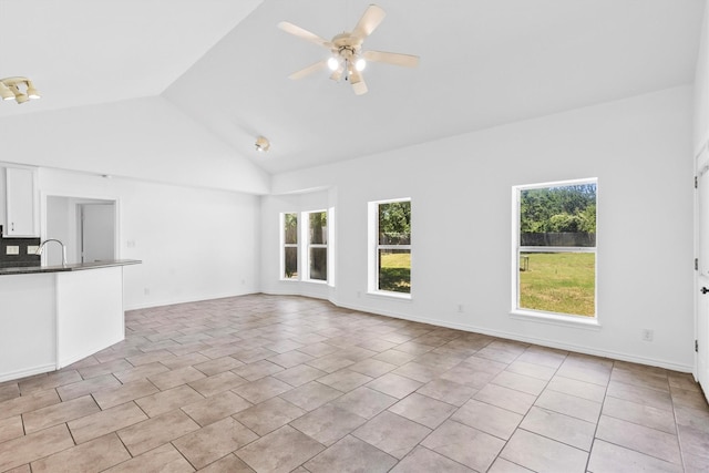 7578 Dick Price Rd, Mansfield, TX 76063 - unfurnished living room featuring light tile patterned floors, vaulted ceiling, ceiling fan, and a sink