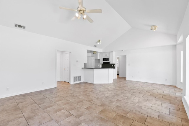 7578 Dick Price Rd, Mansfield, TX 76063 - unfurnished living room with a ceiling fan, high vaulted ceiling, and baseboards