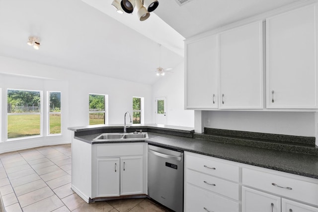 7578 Dick Price Rd, Mansfield, TX 76063 - kitchen featuring dishwasher, a sink, a peninsula, white cabinetry, and vaulted ceiling