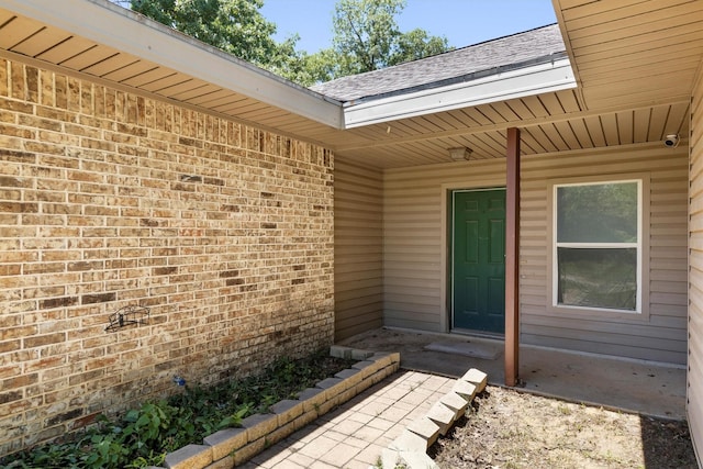 7578 Dick Price Rd, Mansfield, TX 76063 - view of exterior entry featuring brick siding and a surveillance system