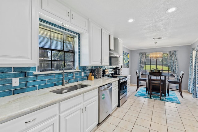 5240 Hill Ridge Dr, Fort Worth, TX 76135 - kitchen with a sink, stainless steel appliances, backsplash, baseboards, and white cabinets