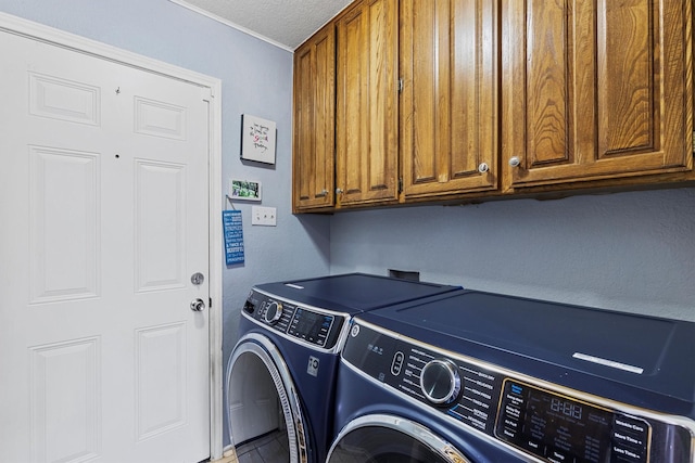 5240 Hill Ridge Dr, Fort Worth, TX 76135 - laundry area featuring washer and dryer, cabinet space, and a textured ceiling