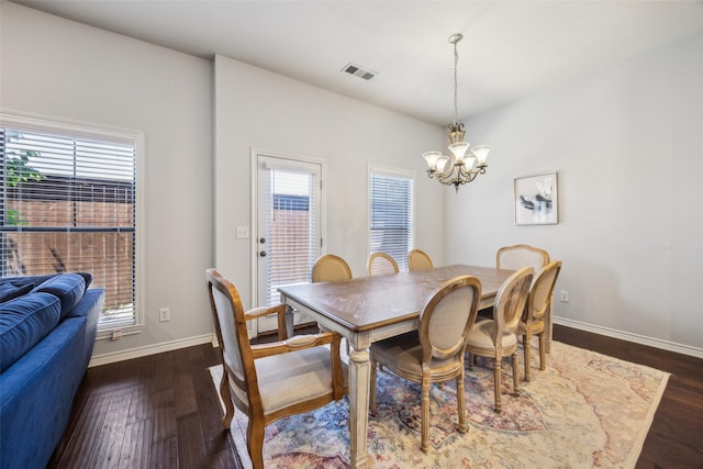 6116 Portrush Dr, Fort Worth, TX 76116 - dining room featuring a chandelier, dark wood-type flooring, and baseboards