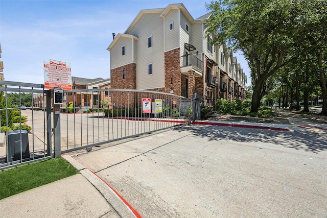 6116 Portrush Dr, Fort Worth, TX 76116 - view of property exterior with brick siding and a gate