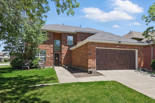 12500 Cajun Dr, Frisco, TX 75035 - view of front of house featuring an attached garage, a front yard, brick siding, and driveway