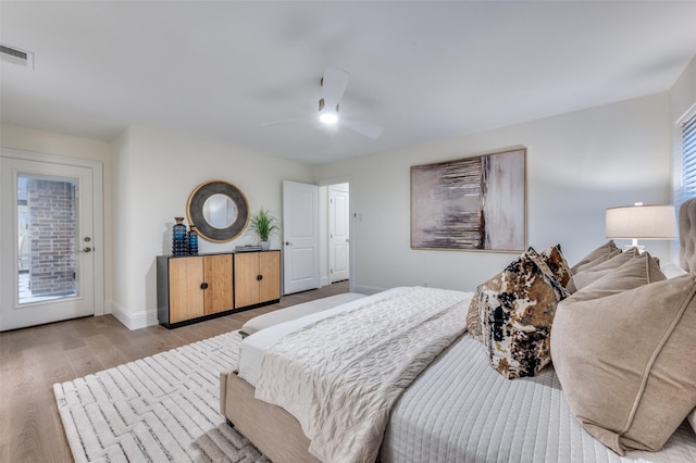 6702 Rolling Vista Dr, Dallas, TX 75248 - bedroom with wood finished floors, baseboards, ceiling fan, and access to exterior
