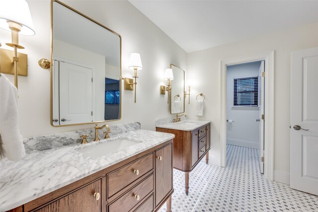 6702 Rolling Vista Dr, Dallas, TX 75248 - full bathroom featuring tile patterned floors, two vanities, and baseboards