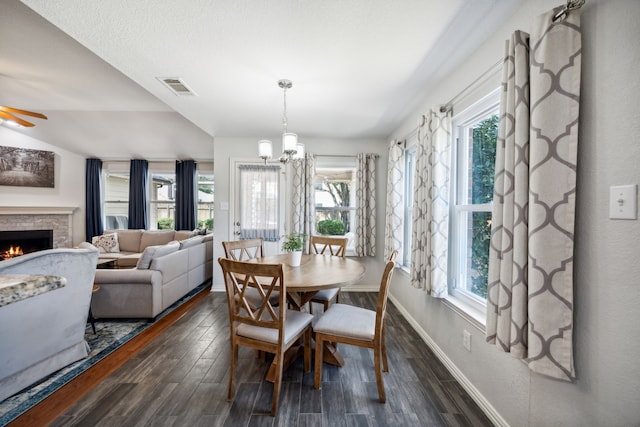 208 Bluefinch, Little Elm, TX 75068 - dining room with baseboards, dark wood-type flooring, and plenty of natural light