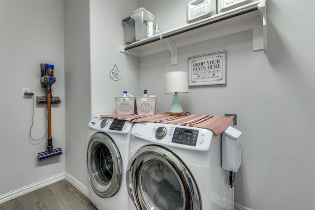 10009 Callan Ln, Fort Worth, TX 76131 - laundry area featuring washing machine and dryer, wood finished floors, and baseboards