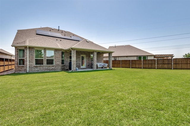 10009 Callan Ln, Fort Worth, TX 76131 - rear view of house with roof with shingles, solar panels, brick siding, and a patio